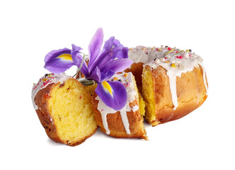 Pieces of tasty Easter cake and flower on white background