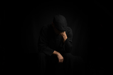 Person covers his face with his hands. Portrait of sadness and bad times