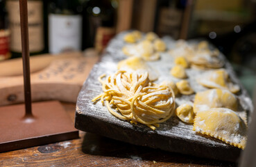 Italian food, fresh home made stuffed pasta tortelli or ravioli dumplings ready to cook, Parma, Emilia Romagna, Italy