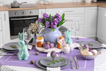 Dining table served for Easter celebration in kitchen