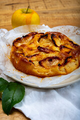 Baked apple cake with almond frangipani custard close up