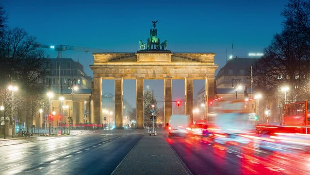 Night Time Lapse of traffic at brandenburg gate in christmas season with christmas tree, Berlin, Germany