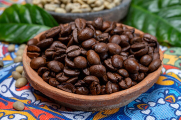 Green and roasted coffee beans from South America coffee producing region, from Colombia and Brazil with  mountain ranges and climate ideal for coffee growing