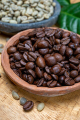 Green un-roasted and brown roasted coffee beans from Africa coffee producing region, cultivating in Ethiopia, Ivory Coast, Uganda, Kenya, Rwanda and Tanzania