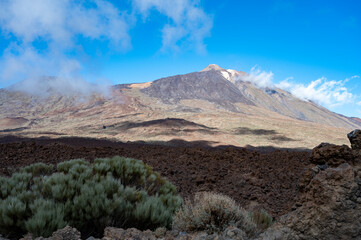Visiting Teide national park on Tenerife and view on volcanic landscapes, Canary islands, Spain