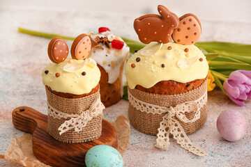 Tasty Easter cakes on light background