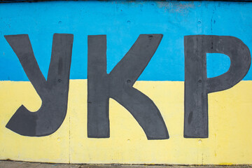 UKR, first Cyrillic letter of word Ukraine, graffiti sprayed on a wall in Dnepr, Ukraine