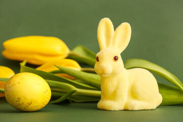 Yellow Easter bunny on green background
