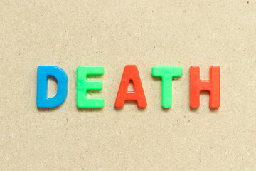 Color alphabet letter with word death on wood background