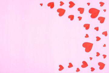 Red hearts papercut on pink background