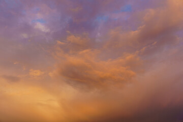 Cloudscape where the clouds glow in orange color
