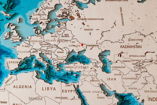 Wooden map of Europe with a pin in the conflict zone in eastern Ukraine after the recognition of the Donetsk and Lugansk region by Russian President Vladimir Putin
