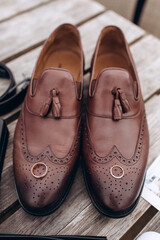 Groom's brown wedding shoes. Wedding accessories. Close-up.