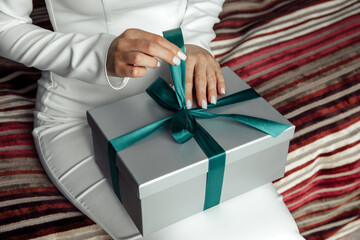 The moment of opening the box. Holiday gift. Close-up.