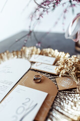 Wedding rings on the table. Wedding details for the ceremony. Wedding accessories. Close-up.