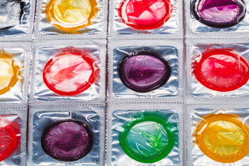Colorful condoms background.