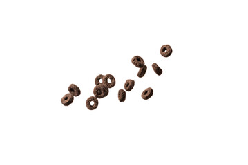 Chocolate rings cereal spill out into a bowl. Breakfast.