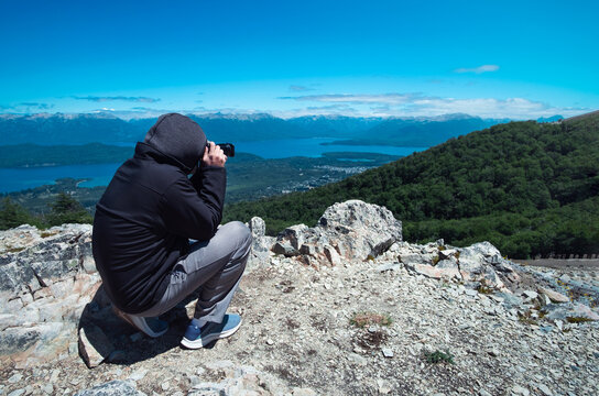 Photographer taking a picture at the top of the mountain. Shooting video recording focusing learning photography teach class lesson course info learning.
Impressive view of the top of the mountain.	
