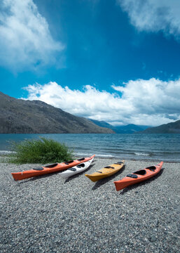 Kayaks on the lake. Stunning view of the coast in nature. Relaxing vacations, travel, adventure exploration.	
