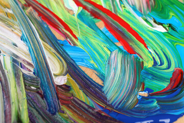 Abstract colorful acrylic paint as background, top view