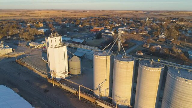 Small town grain elevator storage facility drone view