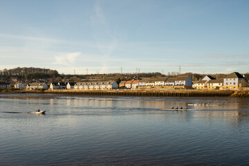 Fototapeta na wymiar Blaydon on Tyne UK: 30th Jan 2022: Rowers on the River Tyne on a early sunday morning. Rowing water sport exercise
