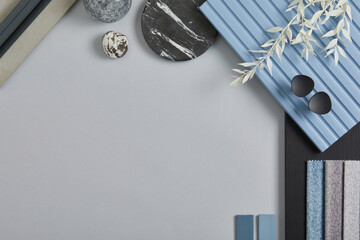 Flat lay composition of stylish architect moodboard with samples of textile, paint, blue wooden...