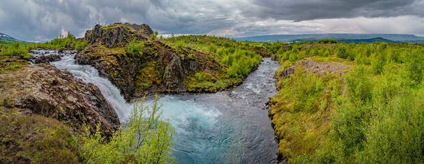 Panoramic view over wonderful and high waterfall Fardagafoss and its cascades near Egilsstadir on Eastern Iceland, summer. © neurobite