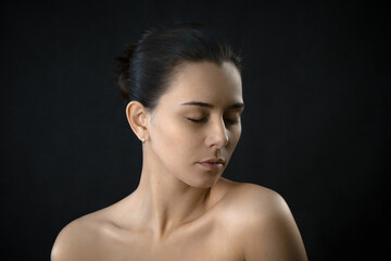 girl on a dark background. Tranquility and relaxation. Rest. The girl is relaxing. visit to the...