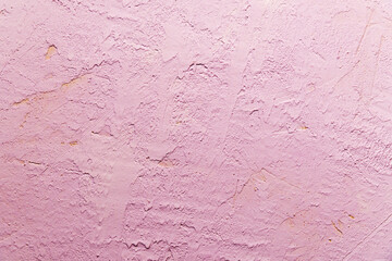 Old wall with peeling stucco. Craquelure pink textured background. Abstract concrete interior