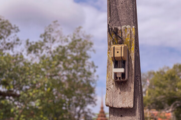 Old electric cutouts on electric pole