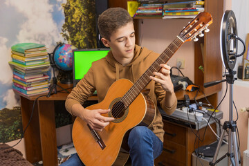 Obraz premium boy playing guitar in his room