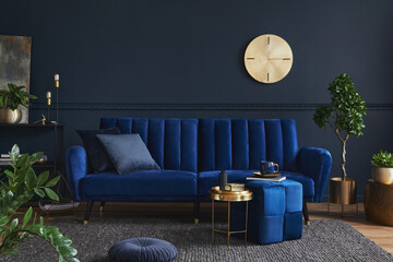 Creative compositon of modern living room interior design with glamour blue sofa, metal shelf,...