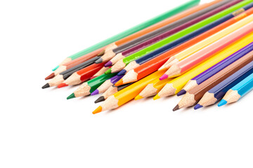 Many multicolored pencils, isolated on white background with copy space. Art and education background.
