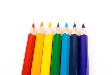 Many multicolored pencils, isolated on white background with copy space. Art and education background.