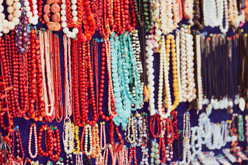 Colorful beads in the souvenir shop close up