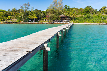 Fototapeta na wymiar Beautiful turquoise sea and wooden bridge at Koh Kood, Trat, Thailand.