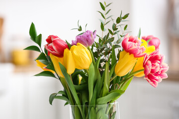 Beautiful flowers in vase on light background, closeup