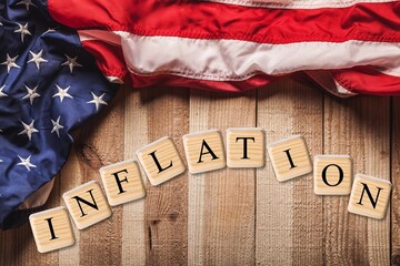USA flag and wooden cubes, concept on the theme of inflation in America