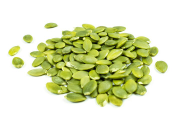 A handful (pile) of peeled pumpkin seeds on a white isolated background. Side view.