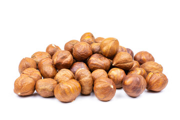 Peeled hazelnuts on a white isolated background. A handful of nuts in close-up. Template for the design.