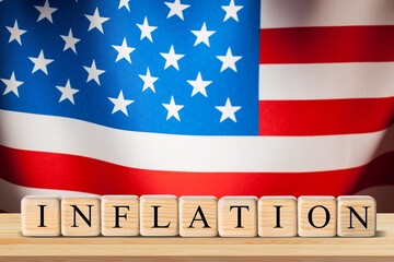 USA flag and wooden cubes, concept on the theme of inflation in America