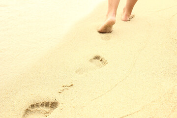 Fototapeta na wymiar footprints in the sand on the beach
