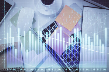 Multi exposure of financial chart drawing over table background with computer. Concept of research and analysis. Top view.