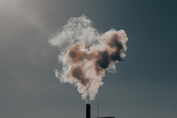 Smoke coming out of factory chimney.