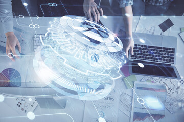 Double exposure of man and woman working together and technology theme drawing hologram. Big data concept. Computer background.