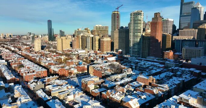 Philadelphia cityscape. Residential urban housing and skyscrapers. Aerial on sunny day after snowstorm.