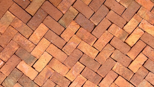 pattern background with brick wall or bricks floor pavement in garden.