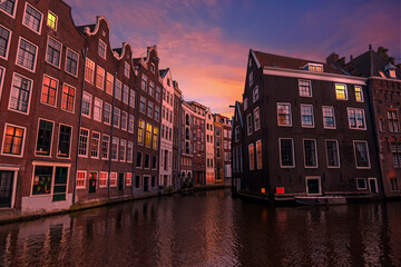 Naklejka premium Traditional houses in the city center from Amsterdam in the Netherlands at sunset