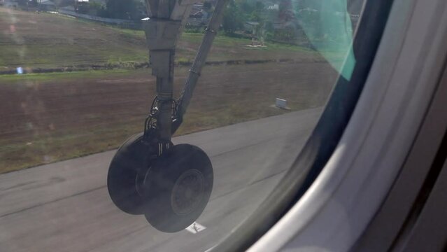 Video showing plane wheel running taking off from runway and got stored in wheel compartment